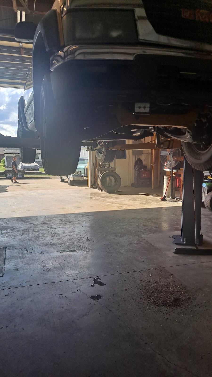 Truck on the lift inside the Ambler shop bay