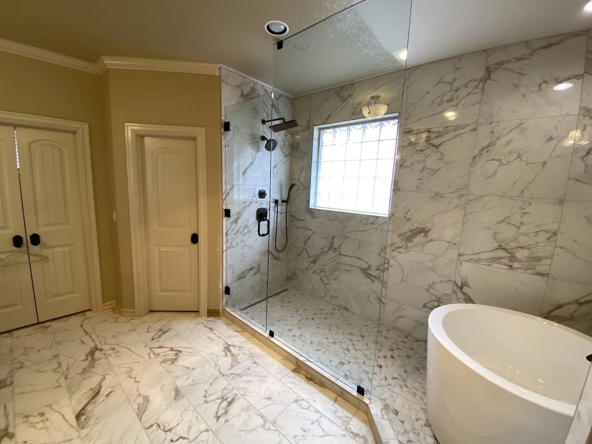 Walk-in shower with glass enclosure