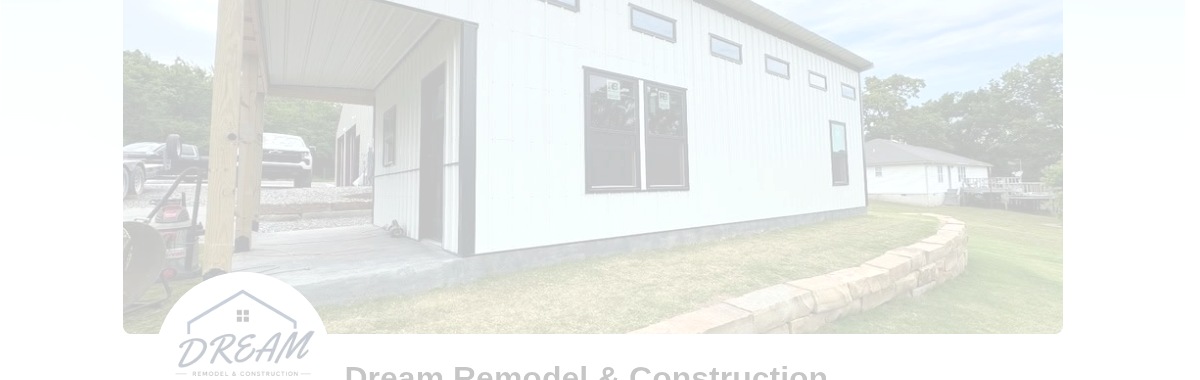 Finished white remodel building with porch and stone retaining wall
