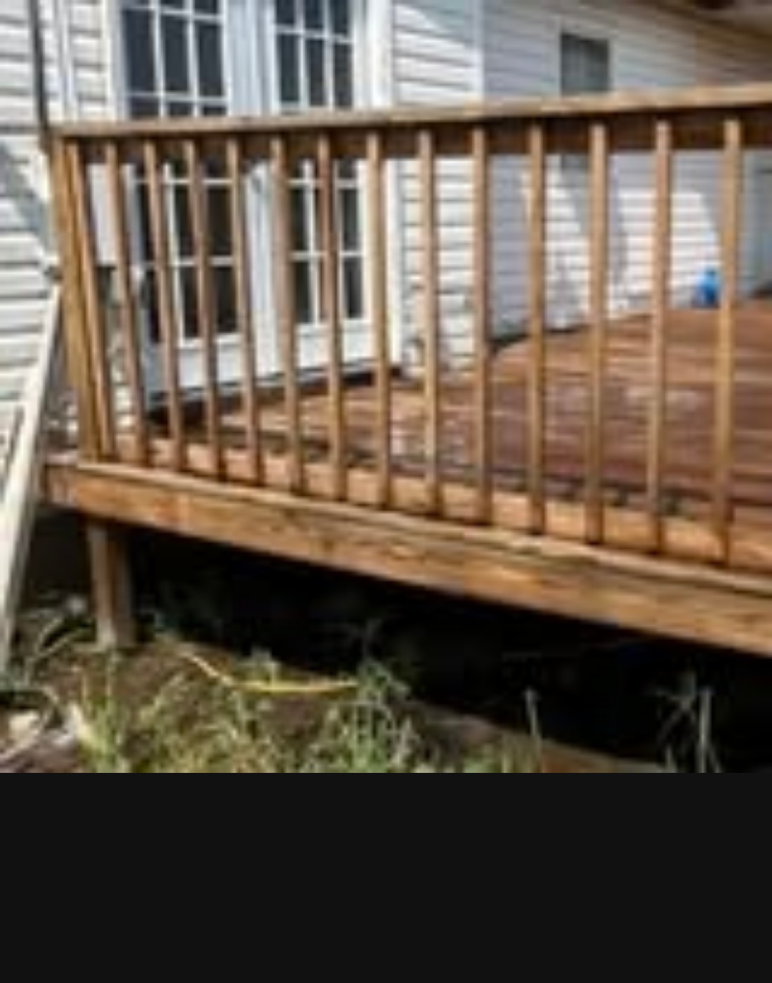 Freshly washed wood deck at a Bartlesville home