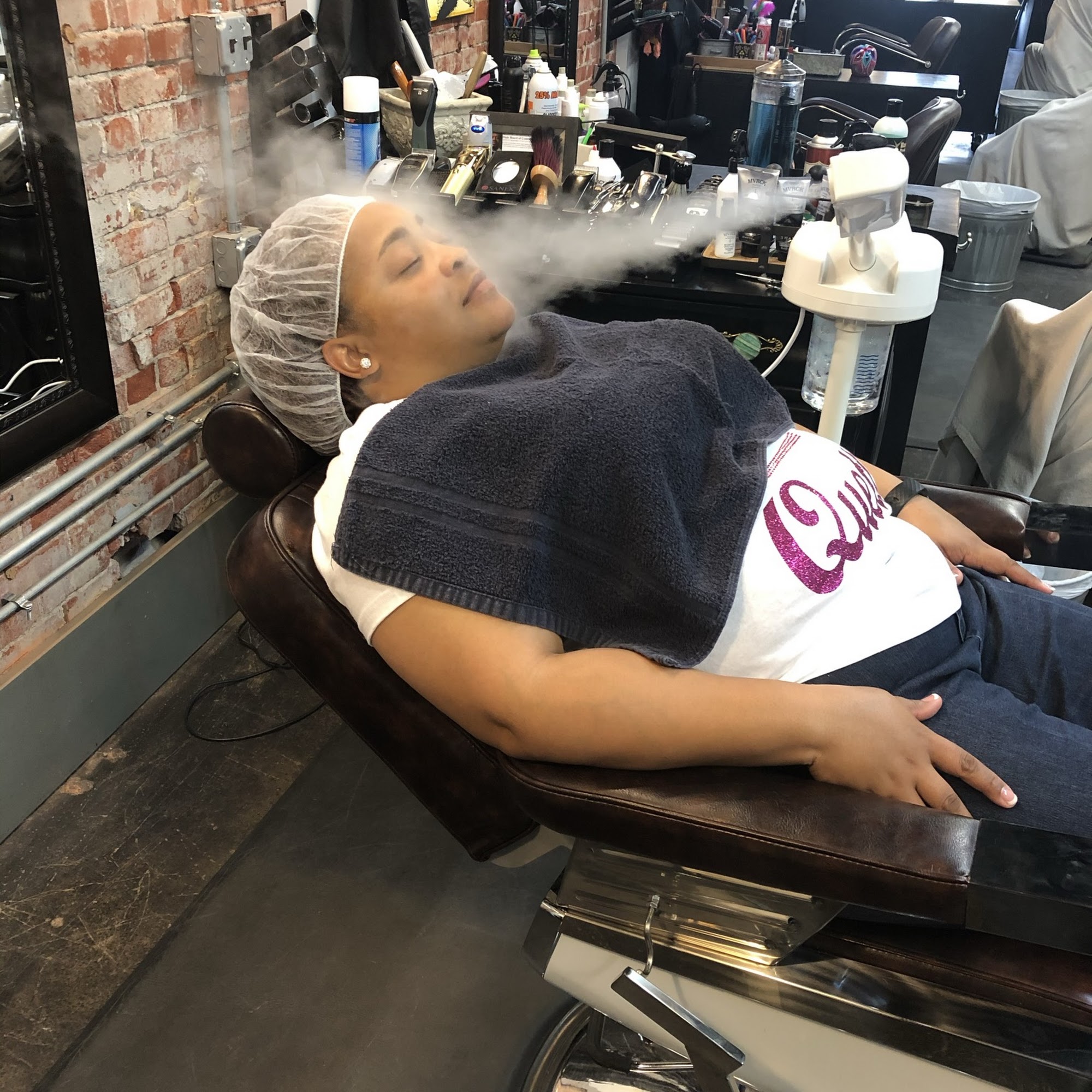 Hot towel service in a classic barber chair