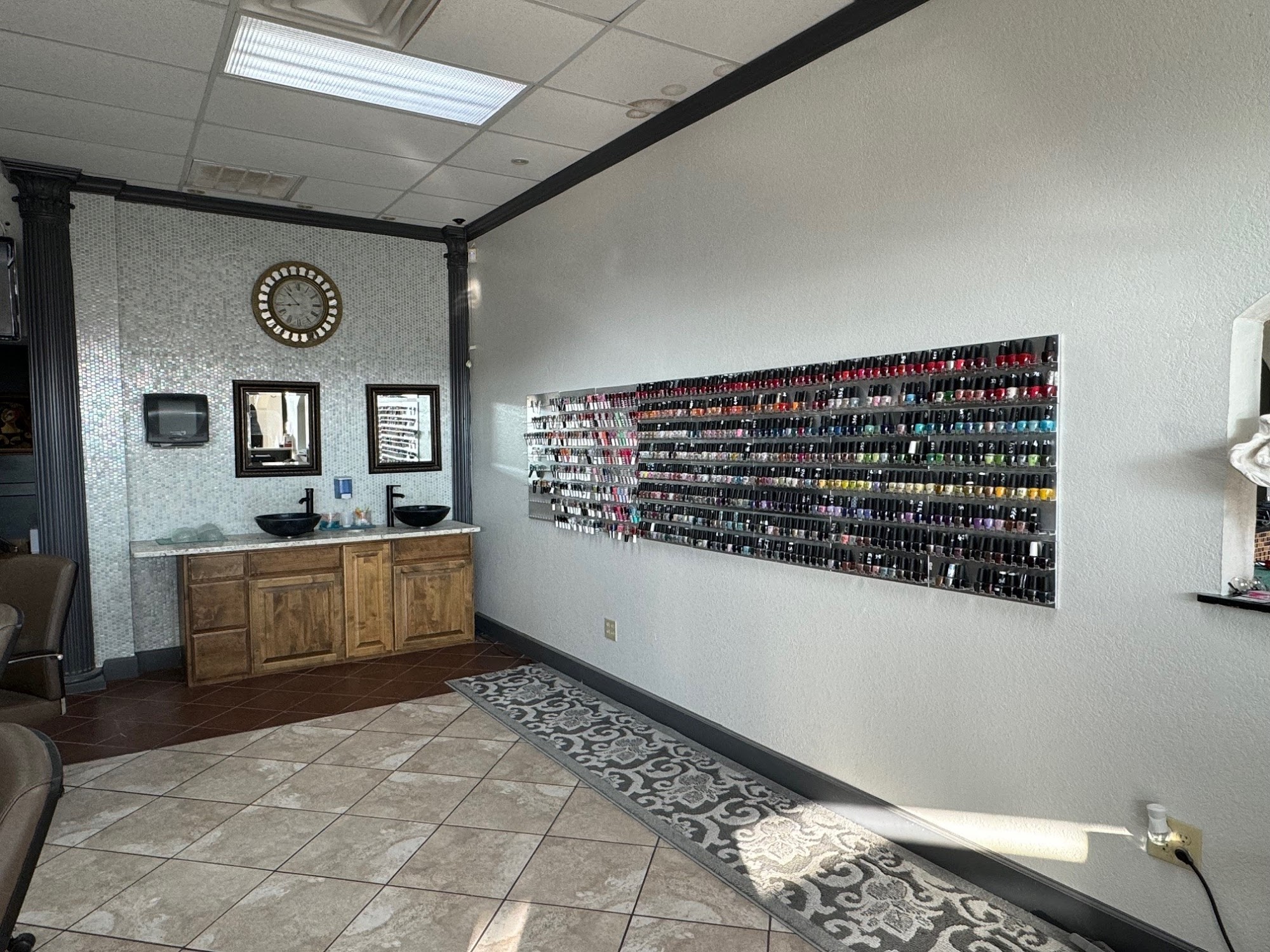 Polish wall and vanity stations inside Elite Nails.