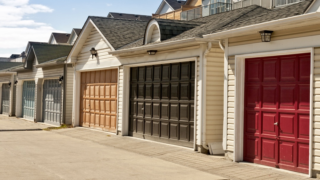 Garage doors installed on a residential garage row